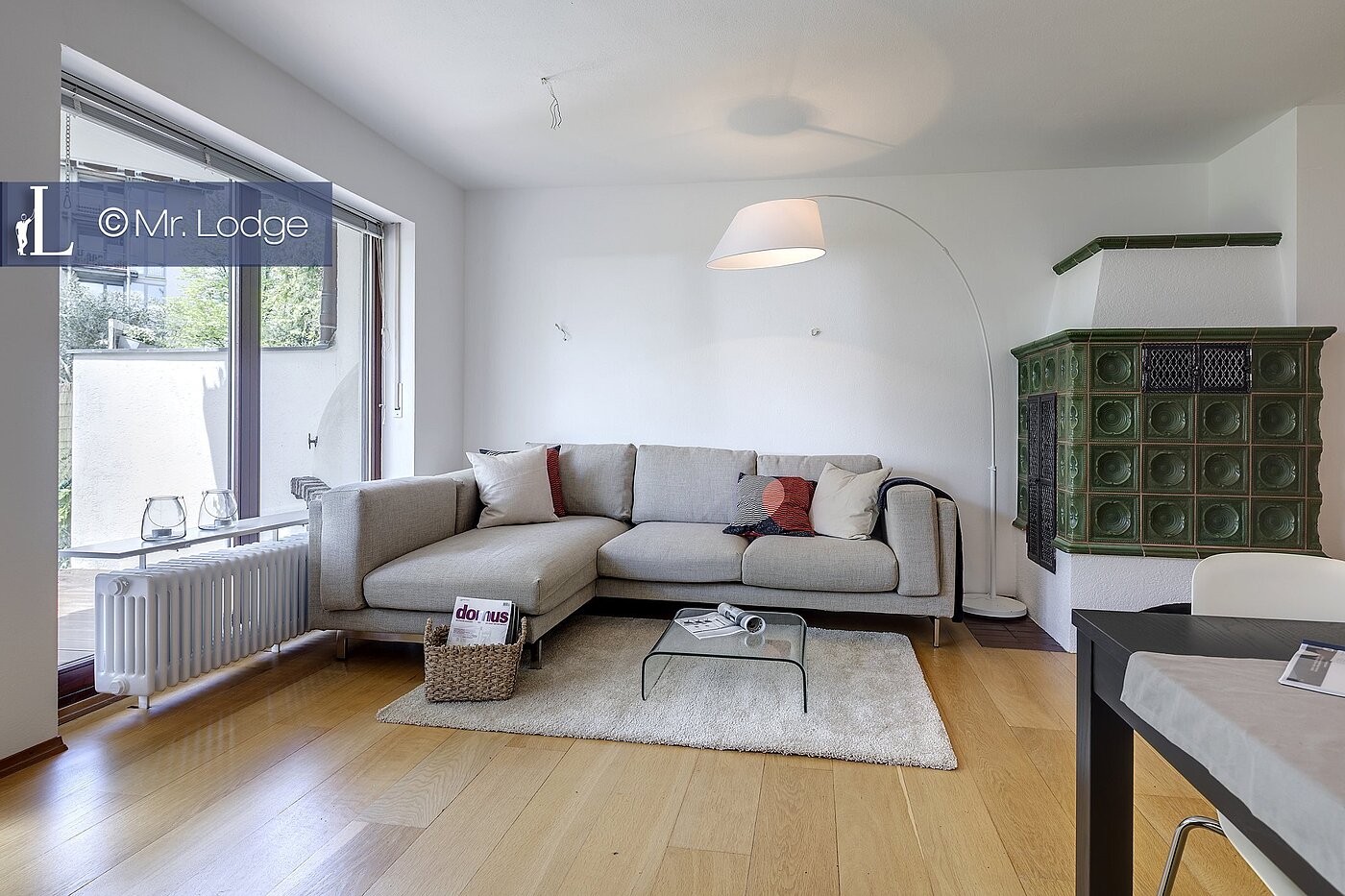 Плоский с 2 комнатами | München-Harlaching | 1704ML6 | Wohnzimmer mit Kachelofen